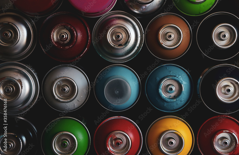 texture of multi-colored spray cans with paint for graffiti, for background and screen saver texture of multi-colored spray cans with paint for graffiti, for background and screen saver