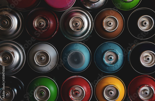 texture of multi-colored spray cans with paint for graffiti, for background and screen saver