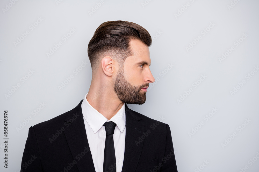 Profile side photo of serious smart investor man look copyspace listen to his collars wear classy outfit isolated over grey color background Profile side photo of serious smart investor man look copyspace listen to his collars wear classy outfit isolated over grey color background