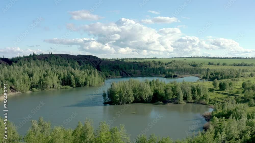 Romantsevo hills and lakes in Tula oblast drone aerial shot drone aerial shot. High quality 4k footage fly over tulskaya oblast romantsevskie hills, konduki shot under cloudy blue sky Romantsevo hills and lakes in Tula oblast drone aerial shot drone aerial shot. High quality 4k footage fly over tulskaya oblast romantsevskie hills, konduki shot under cloudy blue sky