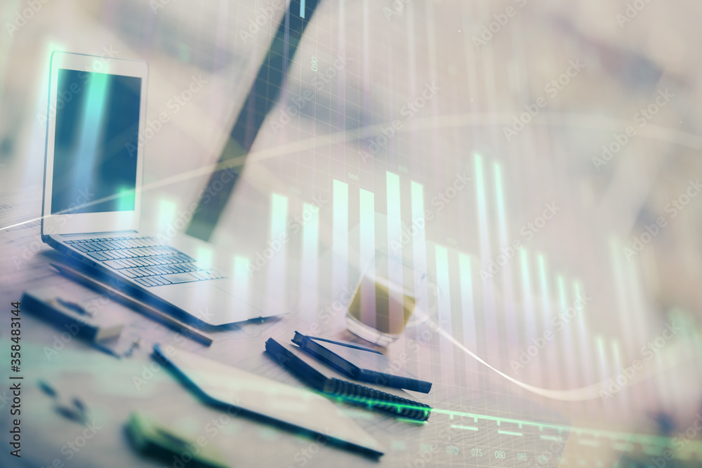 Forex graph hologram on table with computer background. Multi exposure. Concept of financial markets.