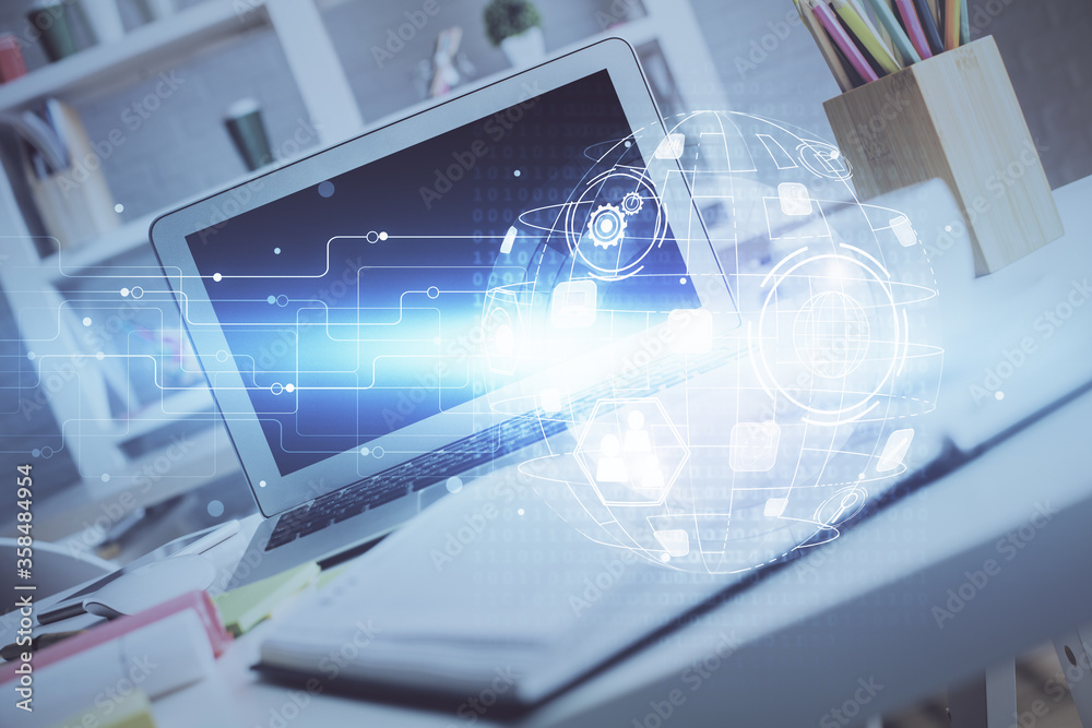 Computer on desktop with social network hologram. Double exposure. Concept of international people connections. Computer on desktop with social network hologram. Double exposure. Concept of international people connections.