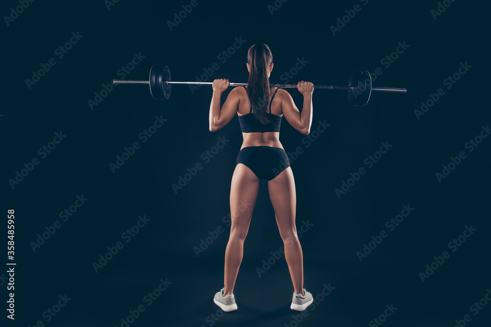 Full size rear behind photo active short sport suit lady heavy barbell shoulders competition isolated black background