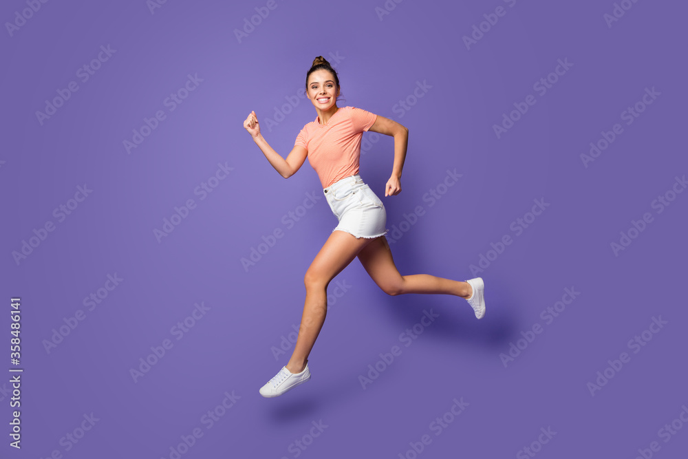 Full length body size view of her she nice attractive lovely purposeful healthy cheerful girl jumping running isolated on bright vivid shine vibrant lilac violet purple color background