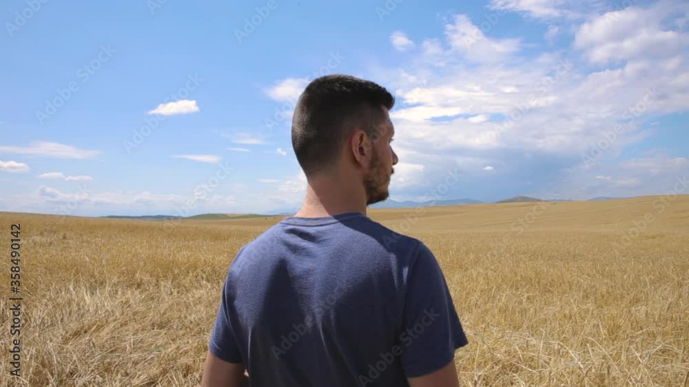 A Man Stand In The Middle Of Grain Field A Man Stand In The Middle Of Grain Field