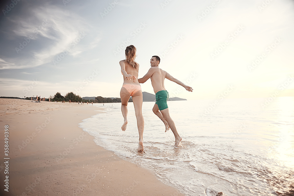 loving couple on the beach / summer vacation, sea coast, love, romantic vacation at sea