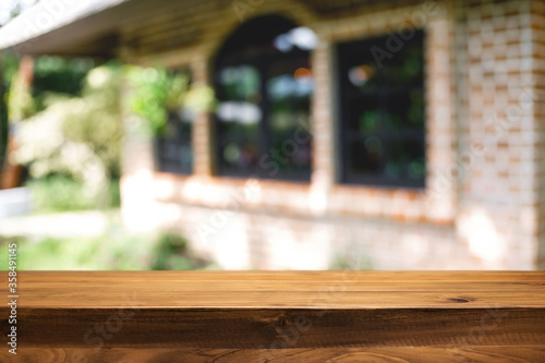 Blurred background of home garden picnic and wooden table free space for product display. © qOppi