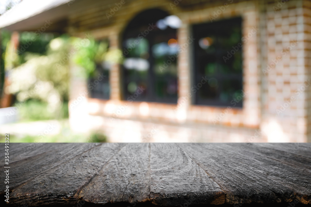 Blurred background of home garden picnic and wooden table free space for product display.