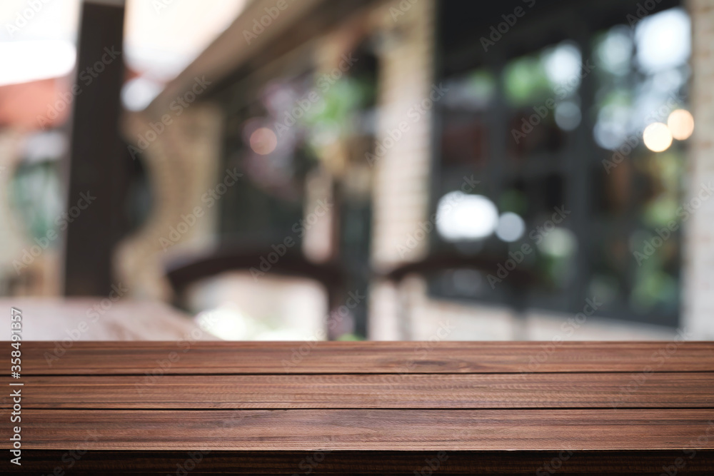 Blurred background of home garden picnic and wooden table free space for product display.