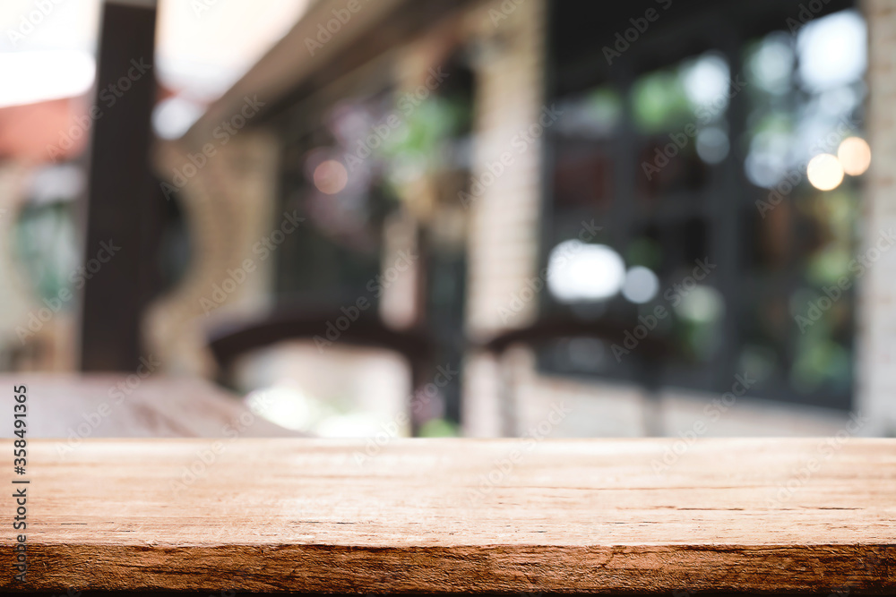 Blurred background of home garden picnic and wooden table free space for product display. Blurred background of home garden picnic and wooden table free space for product display.