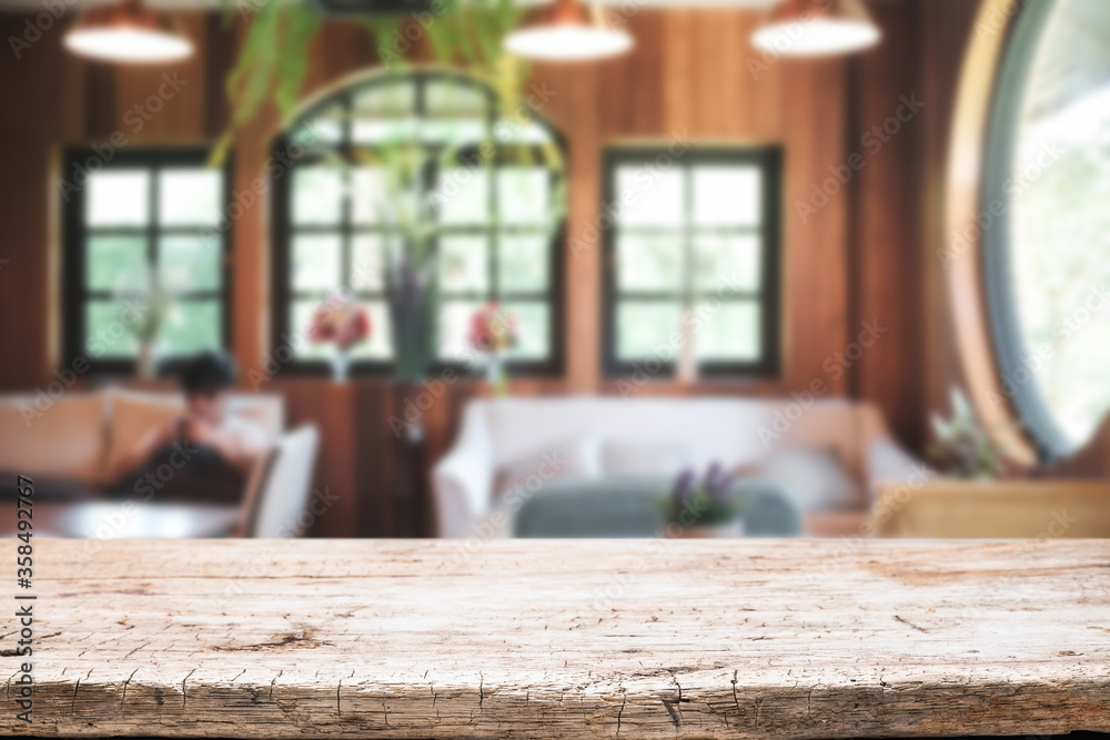 Empty wooden desk space platform and blurred restaurant or coffee shop background for product display montage. Empty wooden desk space platform and blurred restaurant or coffee shop background for product display montage.
