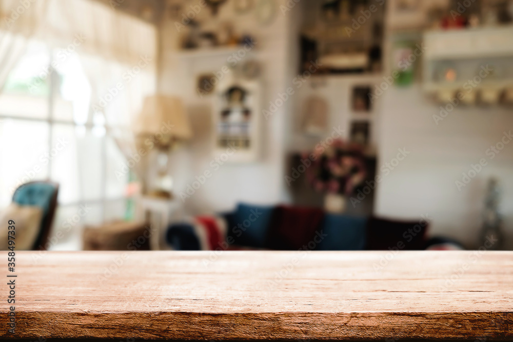 Wooden desk space platform and blurred restaurant or coffee shop background for product display montage. Wooden desk space platform and blurred restaurant or coffee shop background for product display montage.