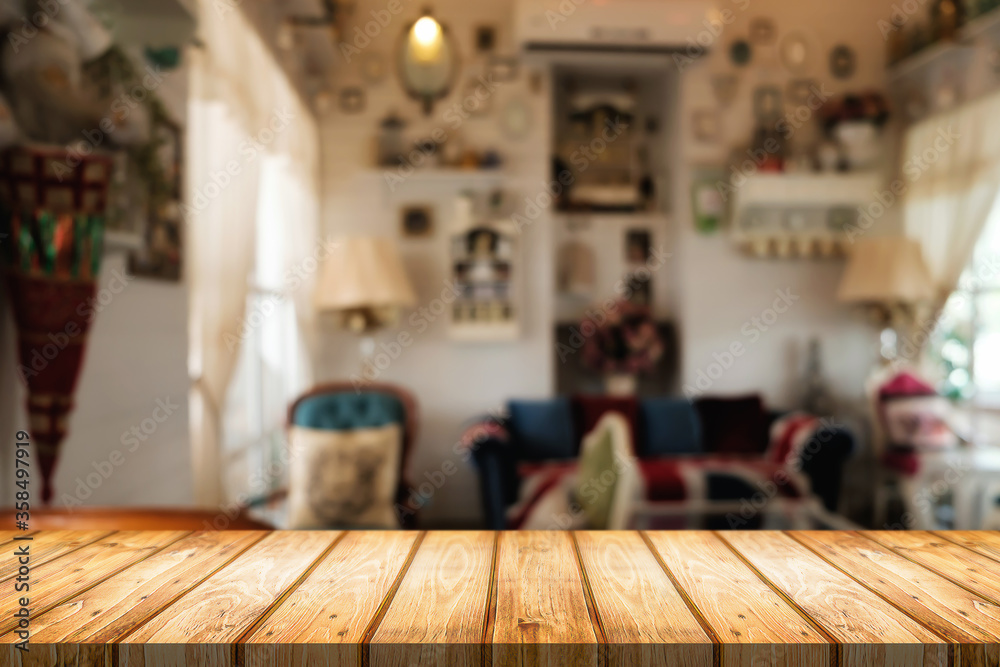 Wooden table space platform and blurred restaurant or coffee shop background for product display montage. Wooden table space platform and blurred restaurant or coffee shop background for product display montage.