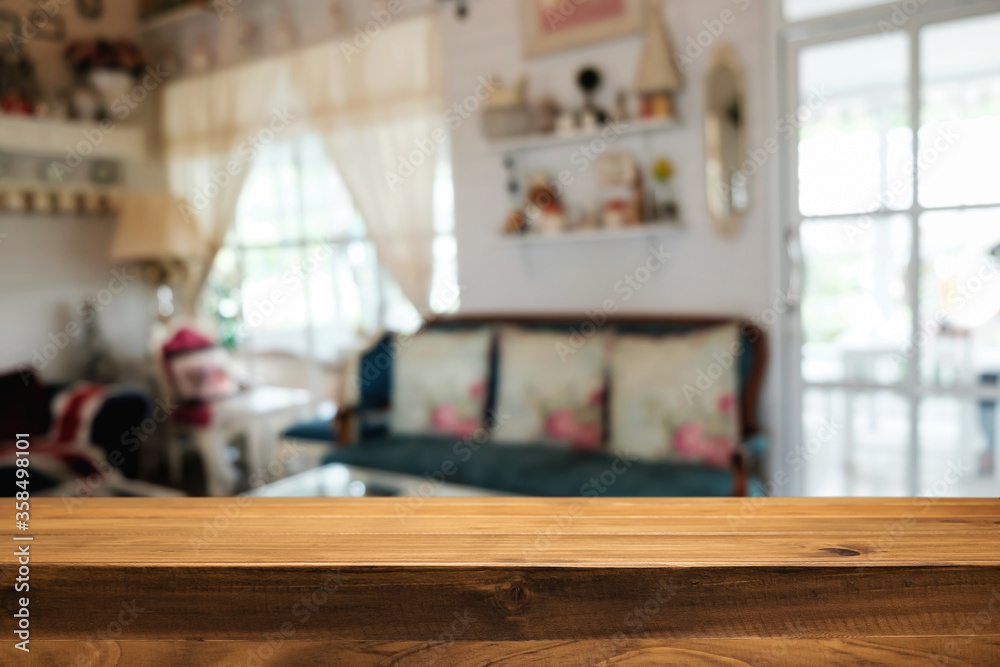 Empty wooden table space platform and blurred restaurant or coffee shop background for product display montage.