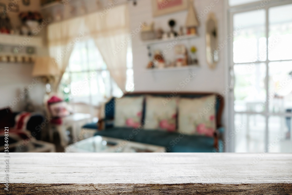 Empty wooden table space platform and blurred restaurant or coffee shop background for product display montage.