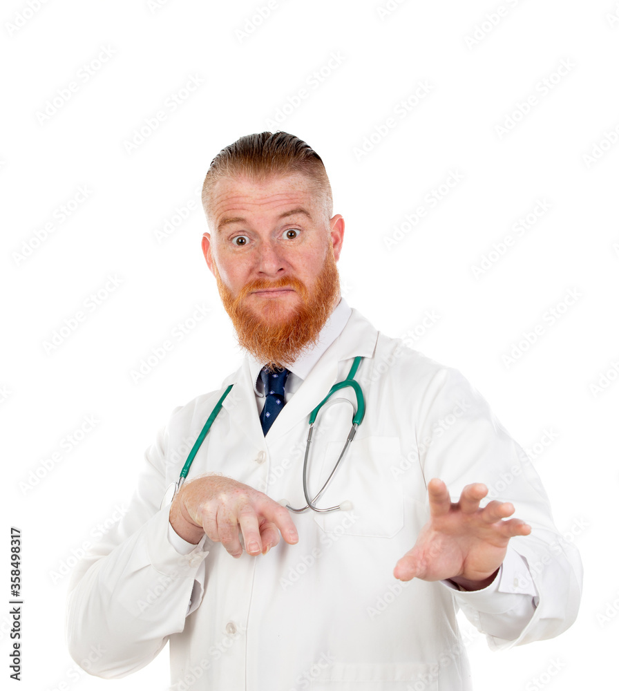Redhead doctor with medical gown pointing at camera Redhead doctor with medical gown pointing at camera