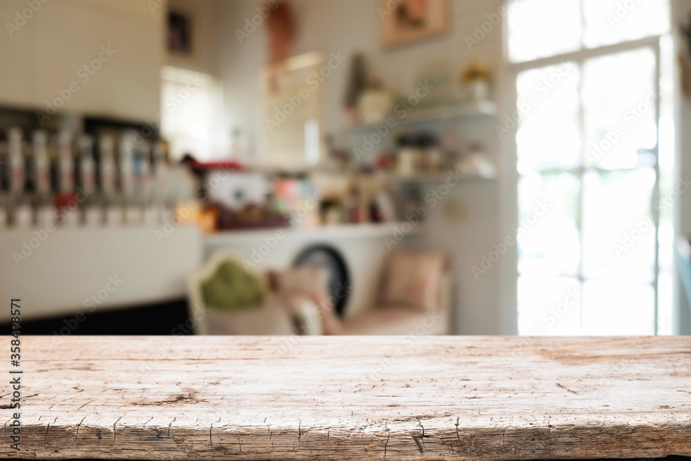 Empty wooden table space platform and blurred restaurant or coffee shop background for product display montage. Empty wooden table space platform and blurred restaurant or coffee shop background for product display montage.