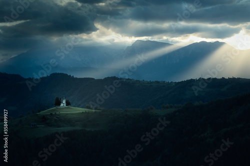 Church lit by a mystical sun rays. Christianity as a way of life.