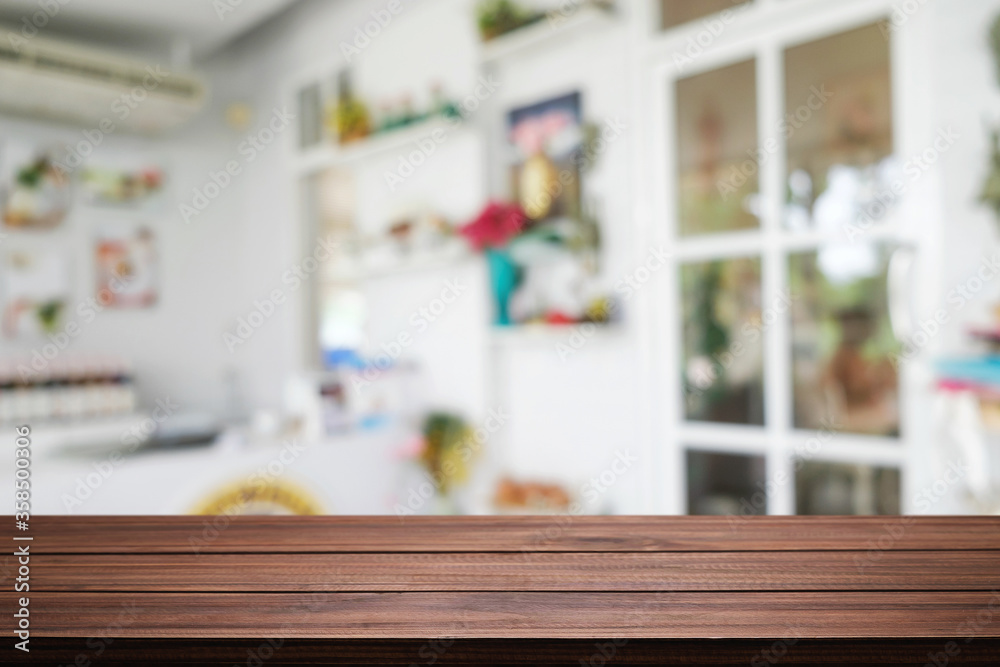 Empty wooden table space platform and blurred restaurant or coffee shop background for product display montage. Empty wooden table space platform and blurred restaurant or coffee shop background for product display montage.