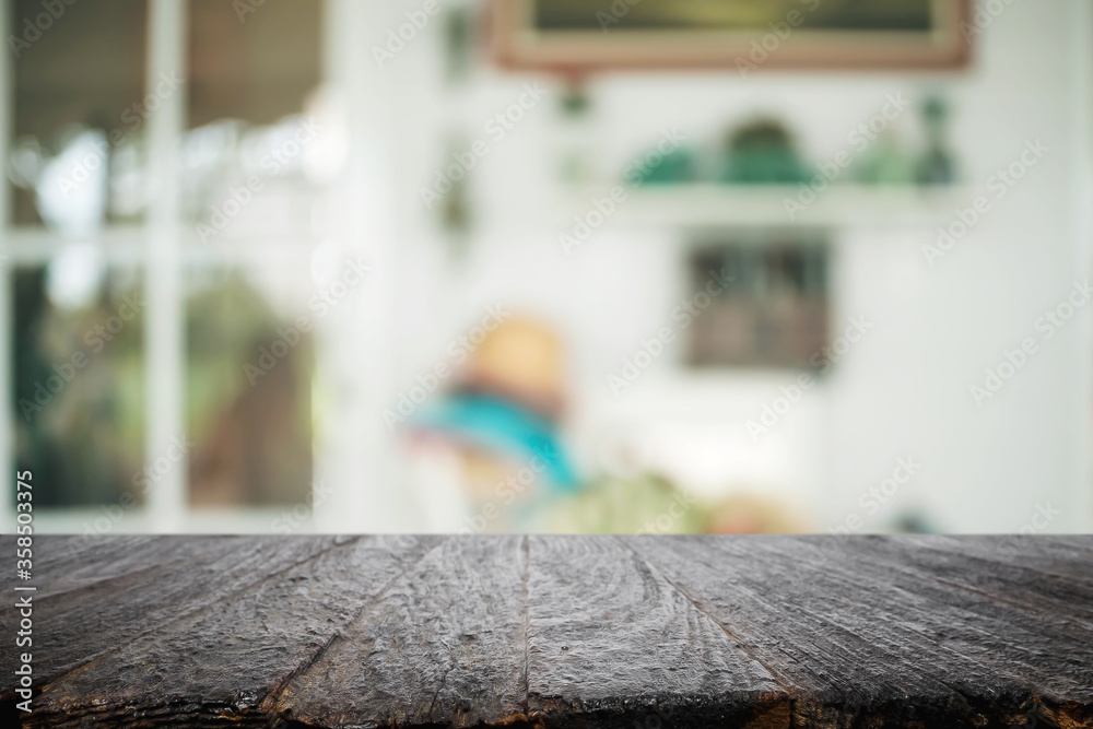 Empty wooden desk space platform over blurred restaurant or coffee shop background for product display montage. Empty wooden desk space platform over blurred restaurant or coffee shop background for product display montage.