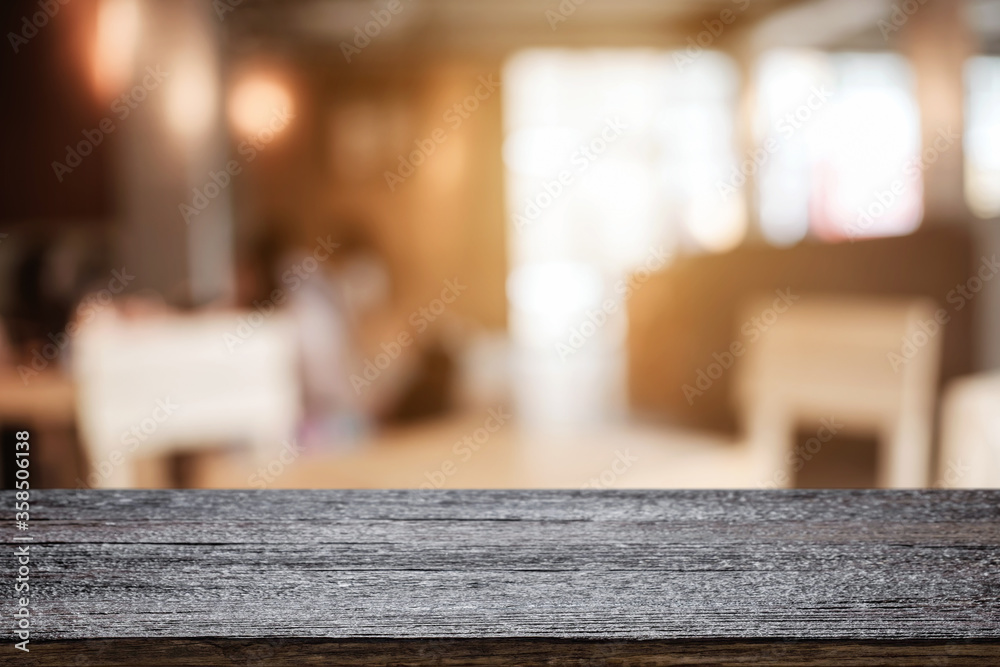 Empty wooden table space platform and blurred resturant or coffee shop background for product display montage. Empty wooden table space platform and blurred resturant or coffee shop background for product display montage.
