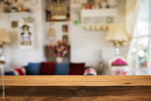 Empty wooden table space platform and blurred resturant or coffee shop background for product display montage.