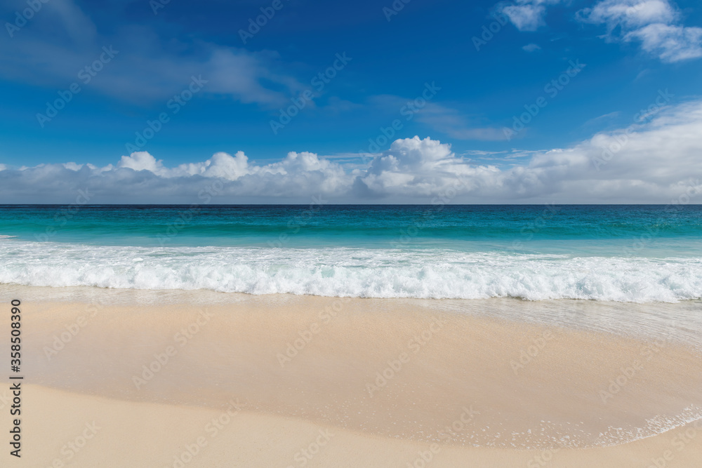 Tropical sea in white sand beach with blue sky