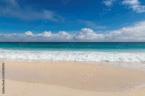 Tropical sea in white sand beach with blue sky © lucky-photo