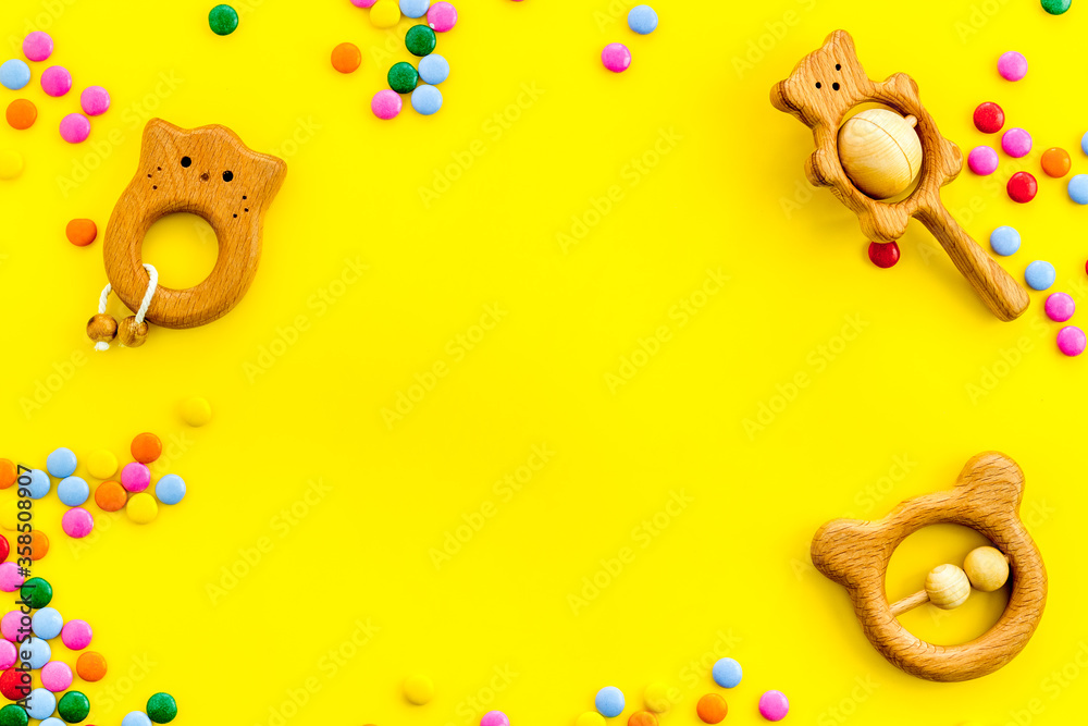 Fototapeta premium kids desk with toys and candy from above space for text