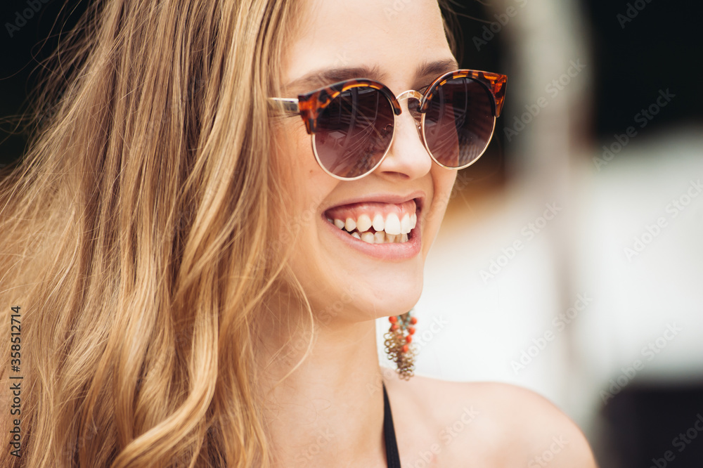 Summer Fashion. Girl Near Pool. Sexy Woman In Trendy Sunglasses And Fashionable Bikini Swimwear And Enjoying Luxury Vacation At Resort Hotel. Summer Fashion. Girl Near Pool. Sexy Woman In Trendy Sunglasses And Fashionable Bikini Swimwear And Enjoying Luxury Vacation At Resort Hotel.