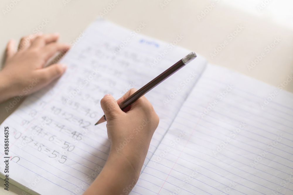 Asia little boy studying from home during the epidemic KOVID-19
Asia little boy studying from home during the epidemic KOVID-19