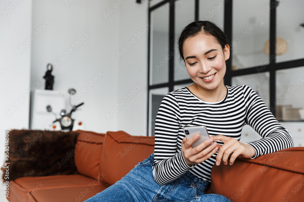 Attractive smiling young asian woman wearing casual clothes Attractive smiling young asian woman wearing casual clothes