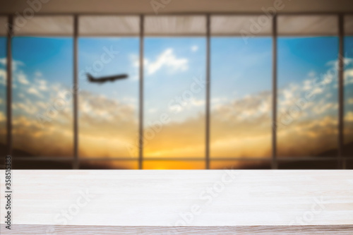 Empty wooden table space platform and Airport background for product display montage.