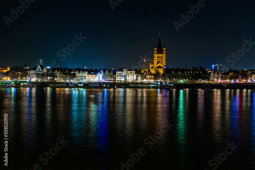 Cologne Germany 22 february2019..view of the promenade of Cologne illuminated by bright colored lights at night from the opposite shore