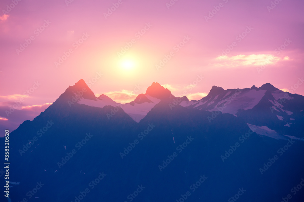 Fototapeta premium Mountain range on the horizon. Rocks at sunset. Beautiful rocky scene in the evening. Wilderness, beautiful nature of Norway, Europe