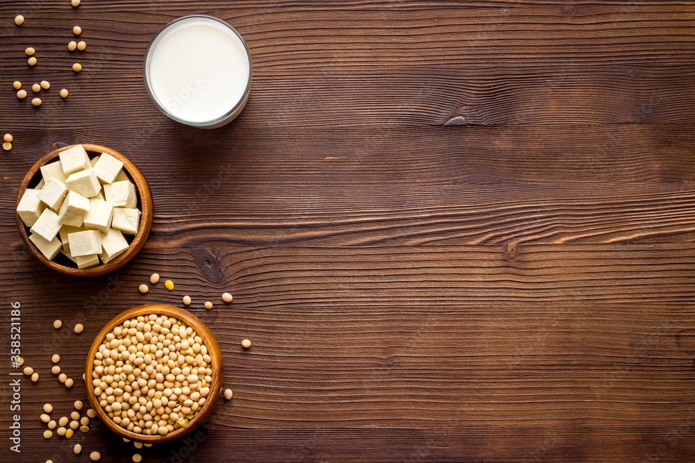 vegan soy milk with soy beans on wooden background top-down copy space vegan soy milk with soy beans on wooden background top-down copy space