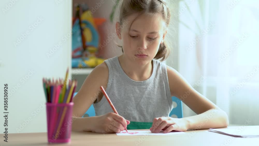 Cute child use laptop for education, online study. Girl has homework at home schooling. Cute child use laptop for education, online study. Girl has homework at home schooling.