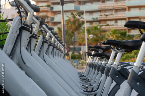 row of bicycles on the street to rent