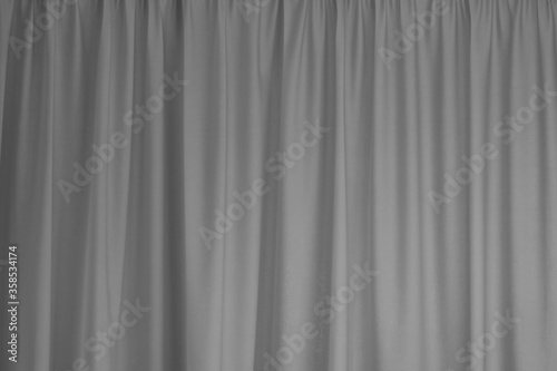 Grey curtain interior textile element close up background