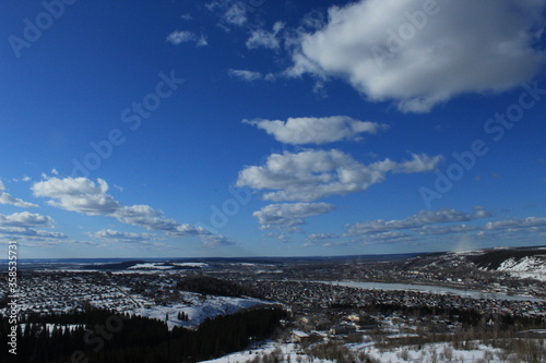 Fototapeta Naklejka Na Ścianę i Meble -  Clouds over a winter city