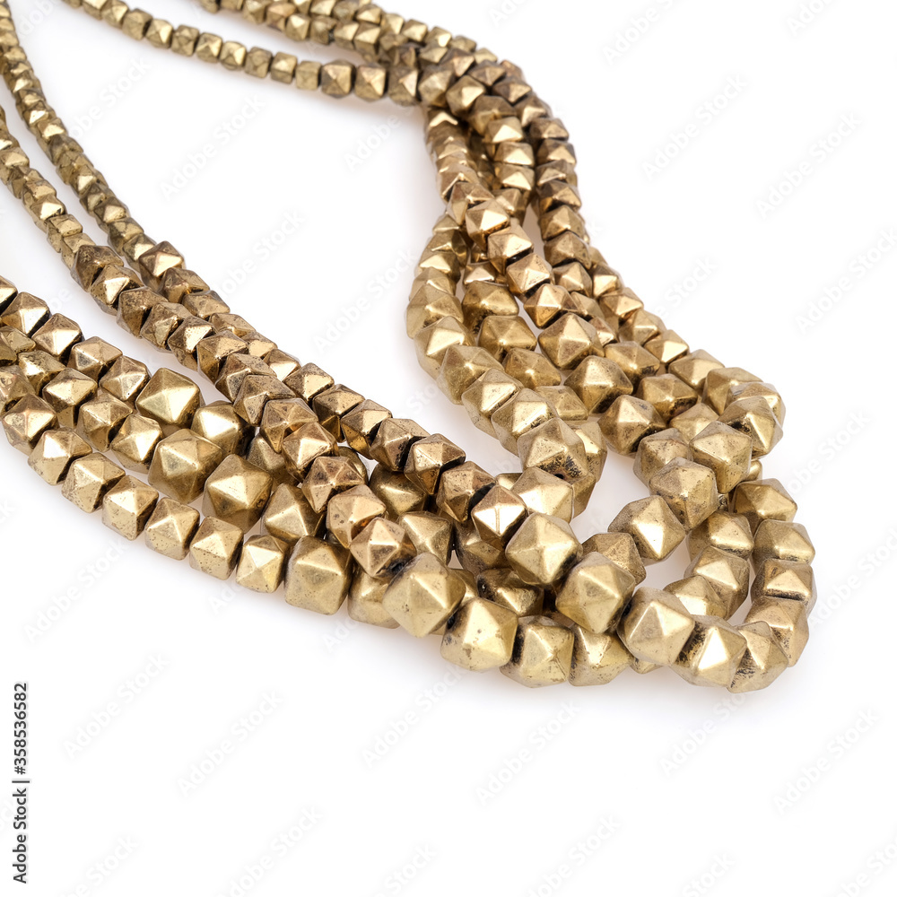 Obraz premium Golden necklaces isolated on a white background