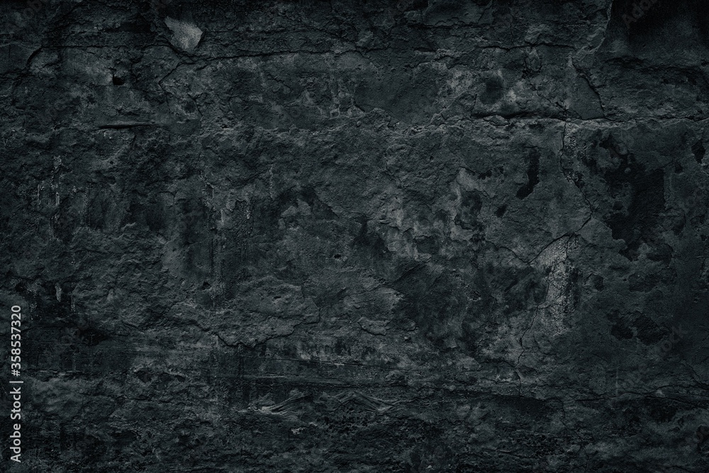 Black weathered concrete wall. Rough broken cement texture. Dark gloomy grunge background