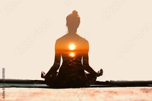 Fototapeta na wymiar Yoga day concept. Multiple exposure image. Woman practicing yoga at sunset.