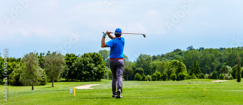 Close up Golfer is driving golf ball to green course