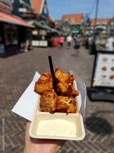 Volendam, Amsterdam/Netherlands-June 25, 2019: Delicious fried fish named kibbeling, served with tartar sauce in Volendam.