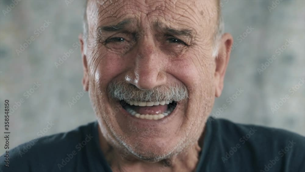 An old man screaming, depressed elderly face. Crying and in sad aged person concept.