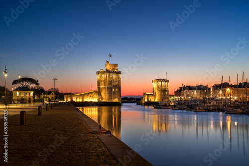 beautiful illuminated cityscape of the old harbor of La Rochelle photo