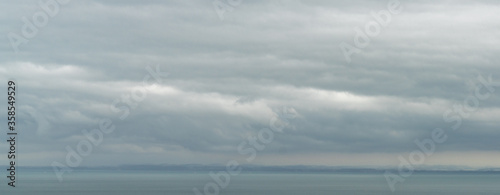 panaroma landscape view of Lake Constance with stormy clouds and rainy weather atmosphere © makasana photo