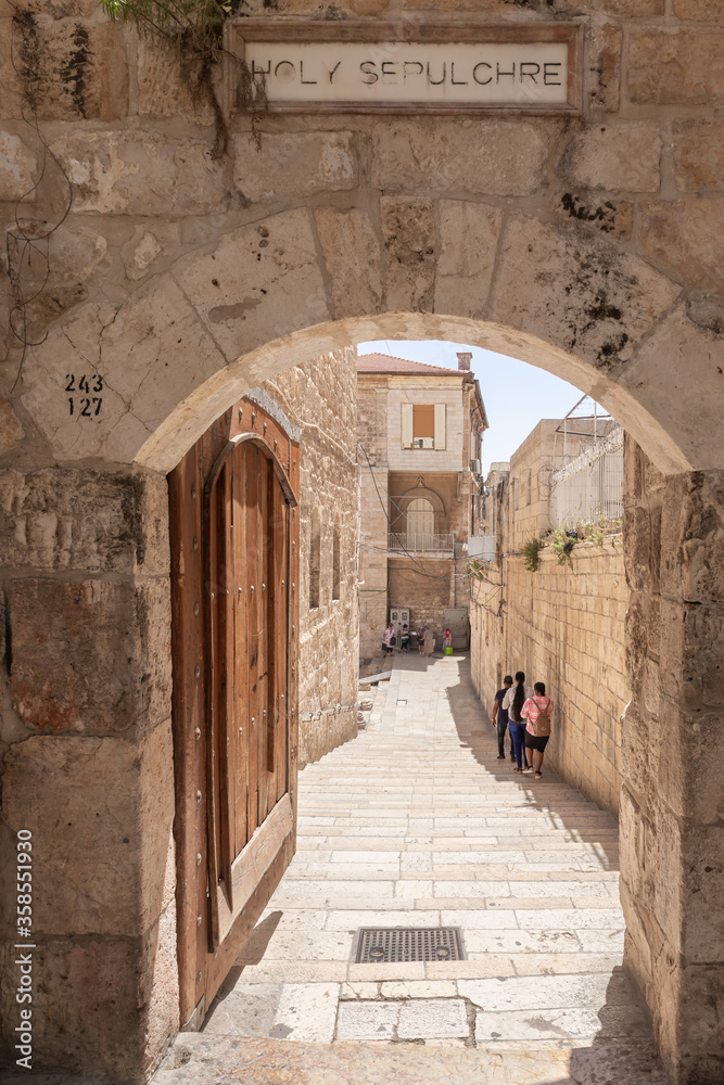 Arched passage to the Church of the Holy Sepulchre from the Arab Quarter in the old city of Jerusalem, Israel