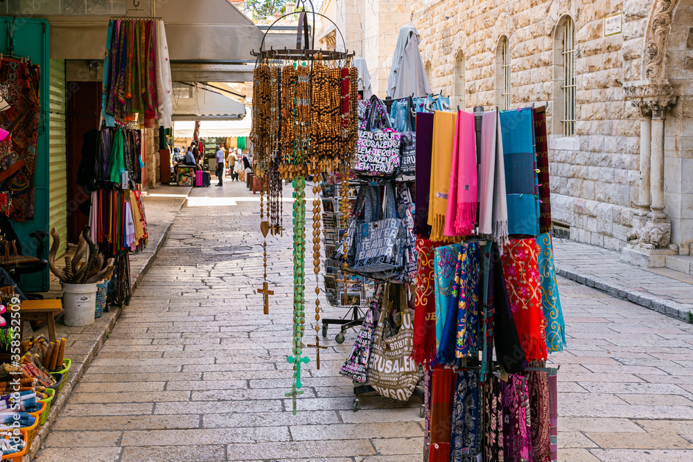 Souvenir stands in the shop of a souvenir merchant on Muristan street in the old city of Jerusalem, Israel